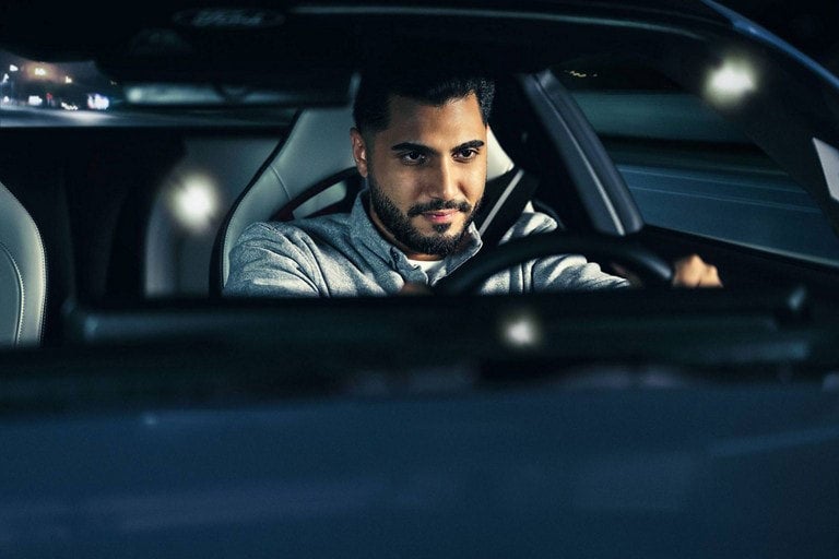 Person sitting in the driver’s seat of a parked 2024 Ford Mustang® coupe | Crow-Moddie Ford in Burlington KS